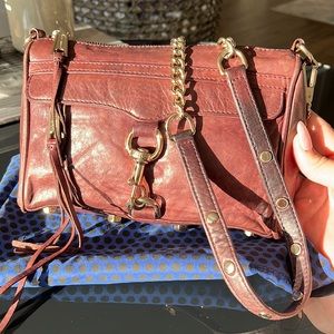 Rebecca mink off cross body bag. Plum color